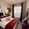 spacious bedroom with large window