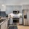 spacious kitchen with stainless steal appliances and cabinets for ample storage